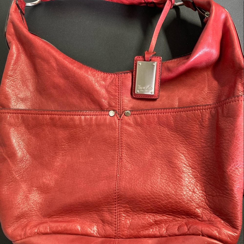 Tignanello Bag Red with multi colored striped lining.